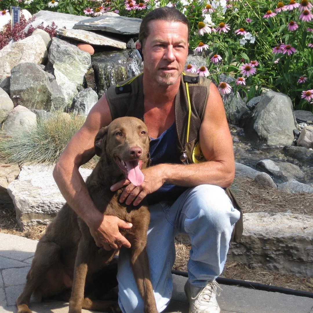 Michael McKay with a Labrador outdoors